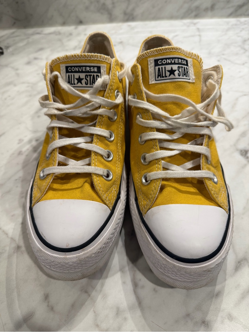 Converse All Star Low Top Sneakers in Yellow. Slight platform